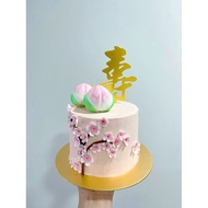 longevity cake with handmade fondant bun and flowers