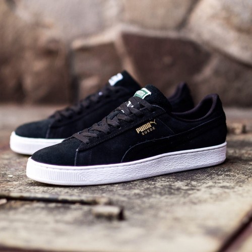 black white puma trainers